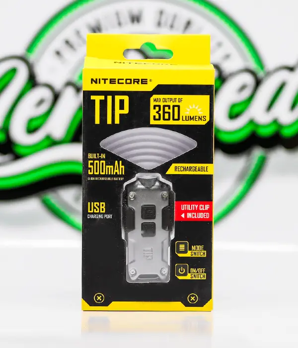 Grey Nitecore TIP LED keyring torch in its yellow blister pack listing 360 lumens and a USB charging port