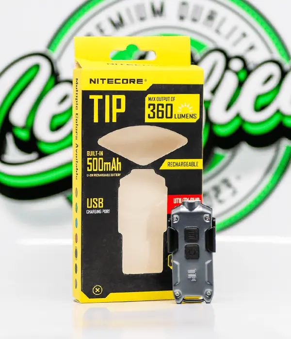 Nitecore TIP 360 lumen USB rechargeable LED keyring torch standing beside its yellow and black retail box