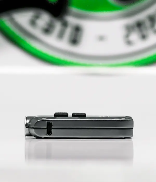 Side profile of Nitecore TIP LED keyring torch showing Micro-USB charging port and dual top buttons