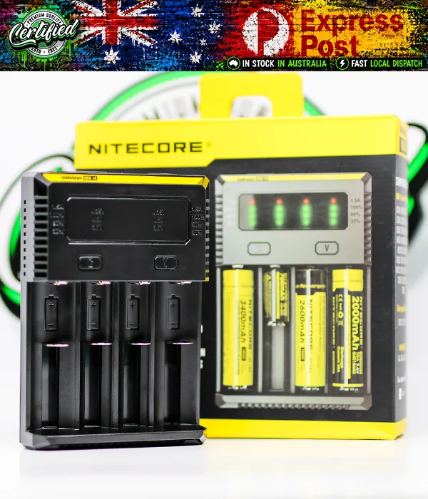Black Nitecore NEW i4 four-bay charger standing beside its yellow retail box, printed with four yellow cells loaded in the bays