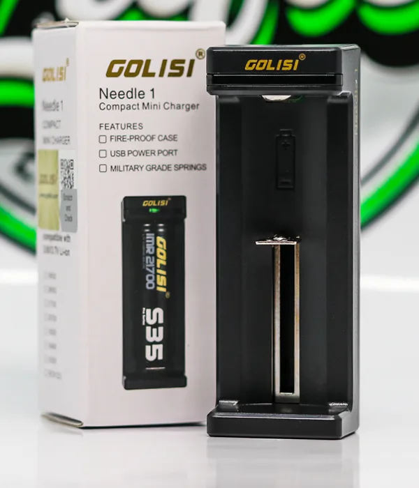 Black Golisi Needle 1 single-bay charger standing beside its Needle 1 Compact Mini Charger retail box