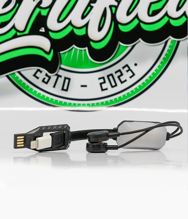 Close view of the LC10 flat cable with its gold-contact USB-A plug, white Lightning tip and two magnetic contact heads behind