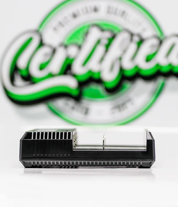 Low side view of the Nitecore NEW i4 charger showing the ribbed vented end panel and the open channels above its battery rails