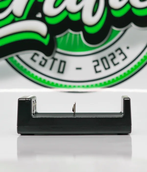 End-on view of the compact Golisi Needle 2 charger showing its slim black body and open battery bay channel
