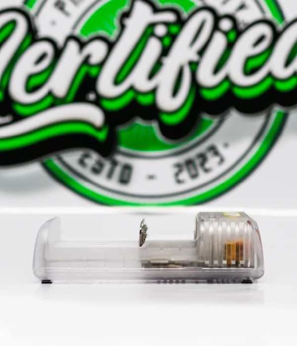 Side profile of the clear Nitecore Q4 charger showing internal circuitry and a sprung slider inside one open bay