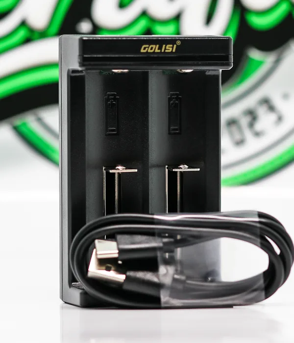 Golisi Needle 2 charger with a black USB cable coiled in front, its USB-A plug facing the camera