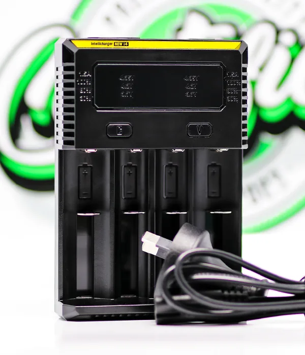 Nitecore NEW i4 four-bay charger with a coiled black cable laid in front, its flat USB-A plug facing the camera